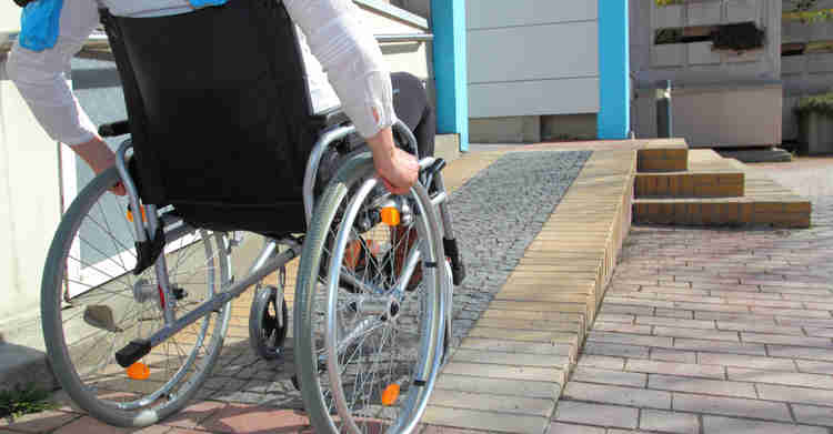 man-on-wheelchair-climbing-ramp