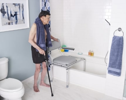 fawwsit-portable-wheelchair-in-the-shower-with-elderly-holding-crane-stick