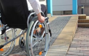 man-on-wheelchair-climbing-ramp