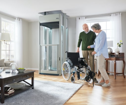 elderly-couple-with-wheelchair-in-front-of-stiltz-home-lift