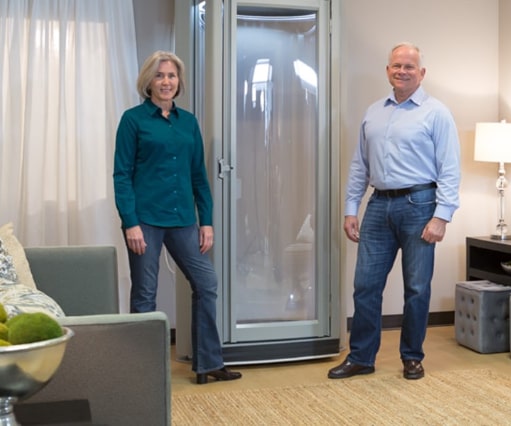 man-and-woman-in-front-of-stiltz-lift-home-lift