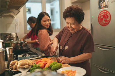 old woman cooking