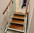 FlexStep lift installed on a wooden staircase, shown in stair configuration