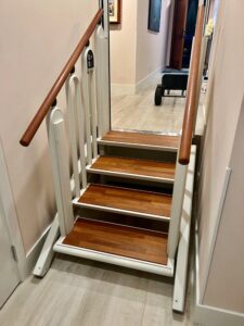 FlexStep lift installed on a wooden staircase, shown in stair configuration