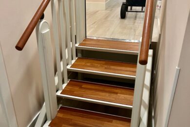 FlexStep lift installed on a wooden staircase, shown in stair configuration