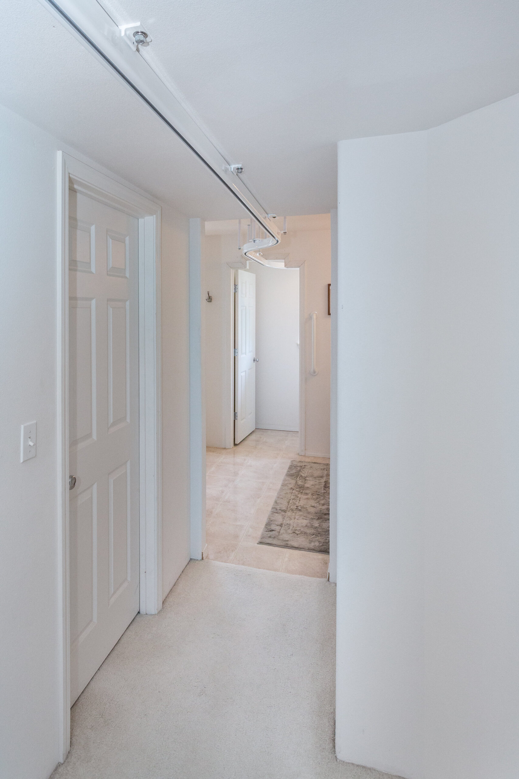 A ceiling track through the hallway: after installation