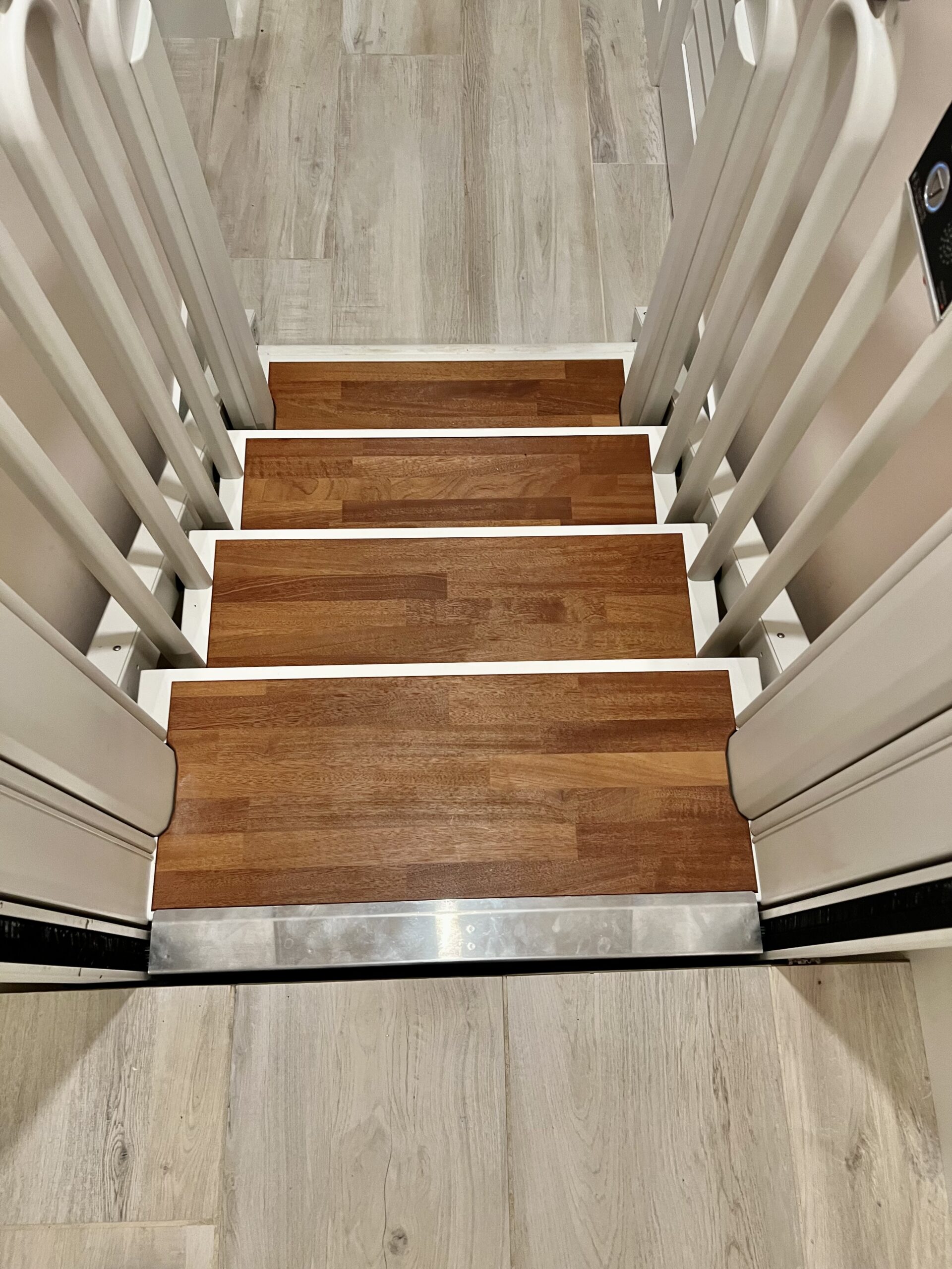 After FlexStep installation: looking down the installed FlexStep in stair mode from the upper landing of the same home