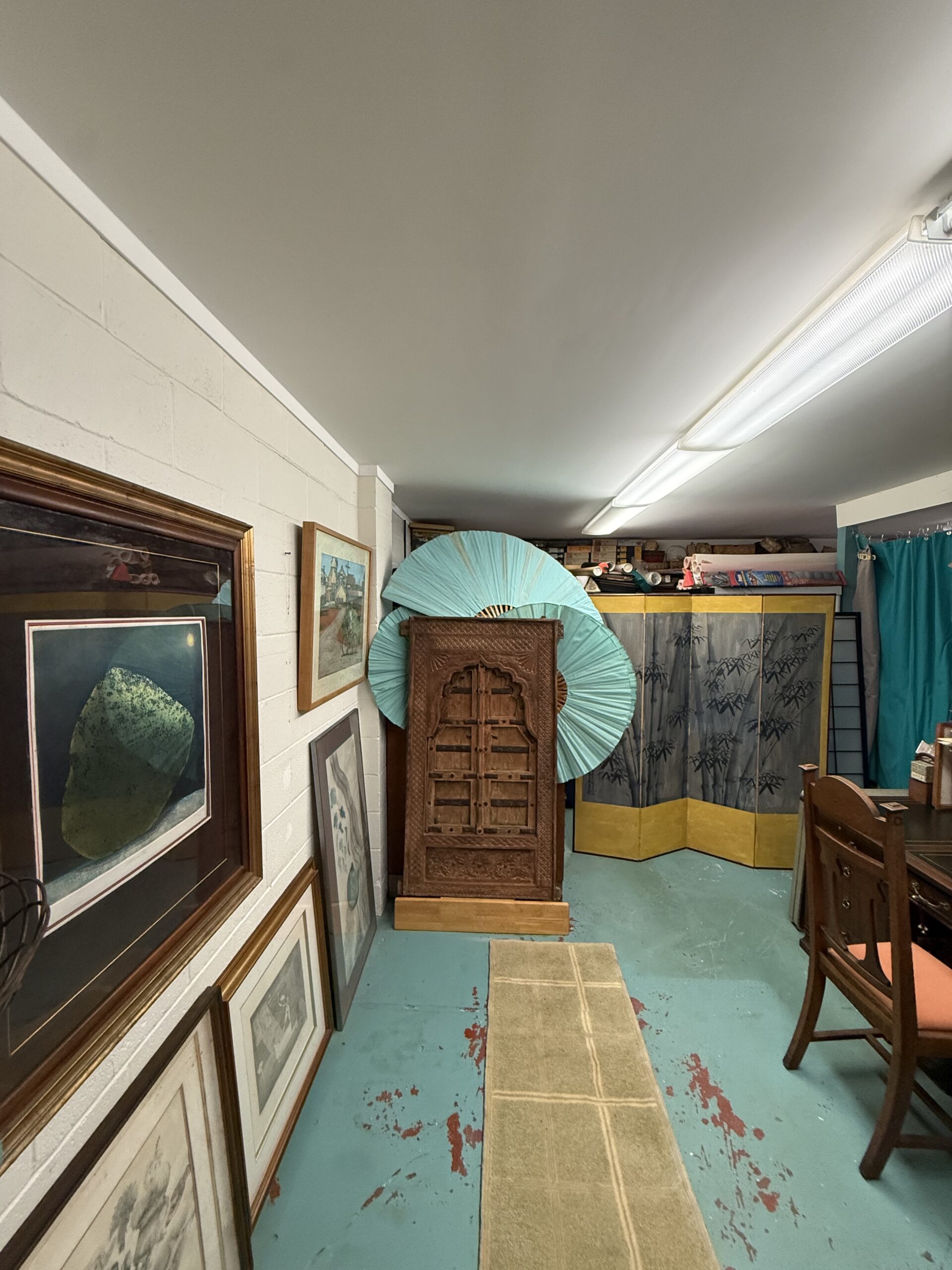 A lower-floor lift beside the work area: before installation