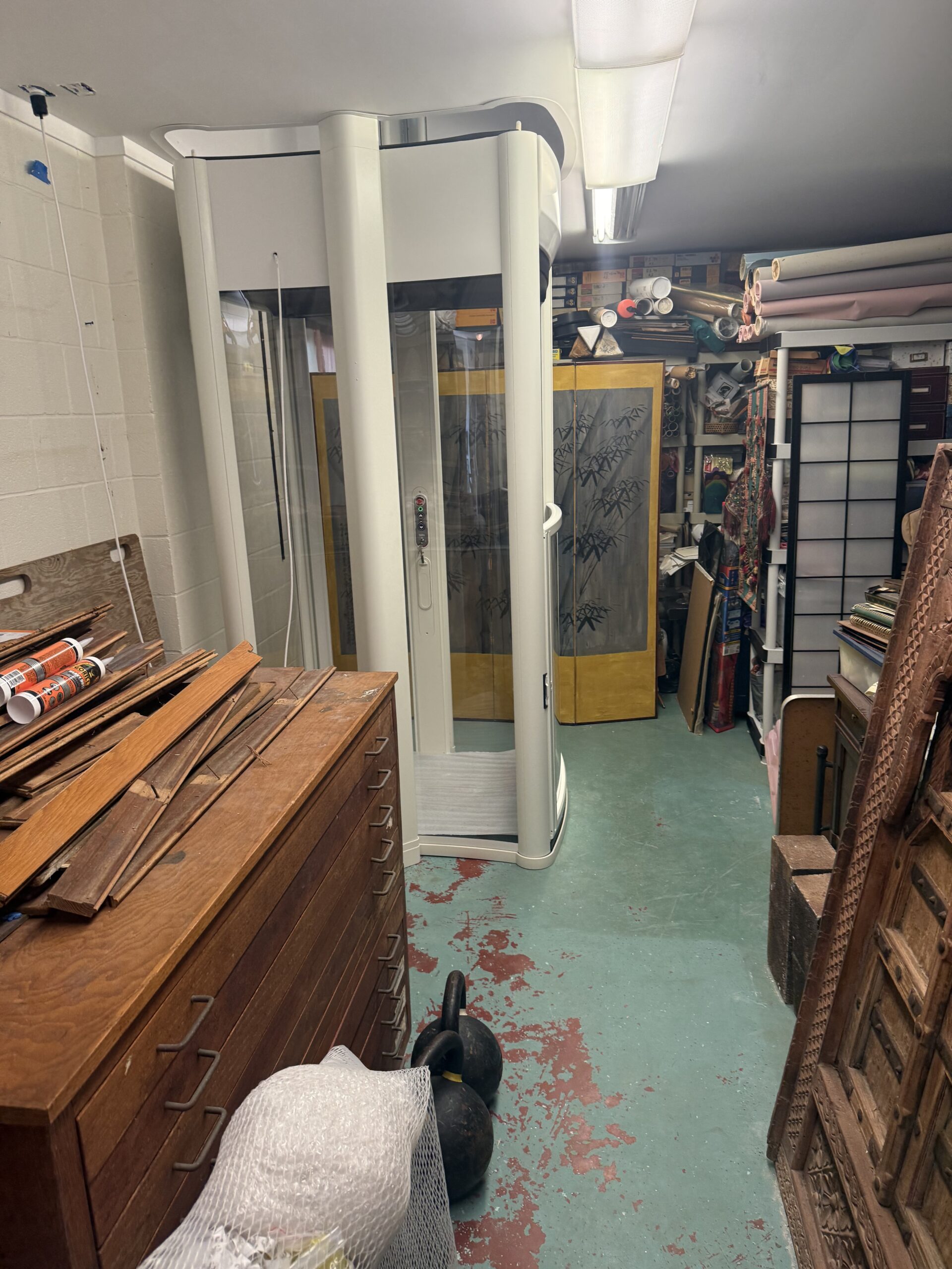 A lower-floor lift beside the work area: after installation