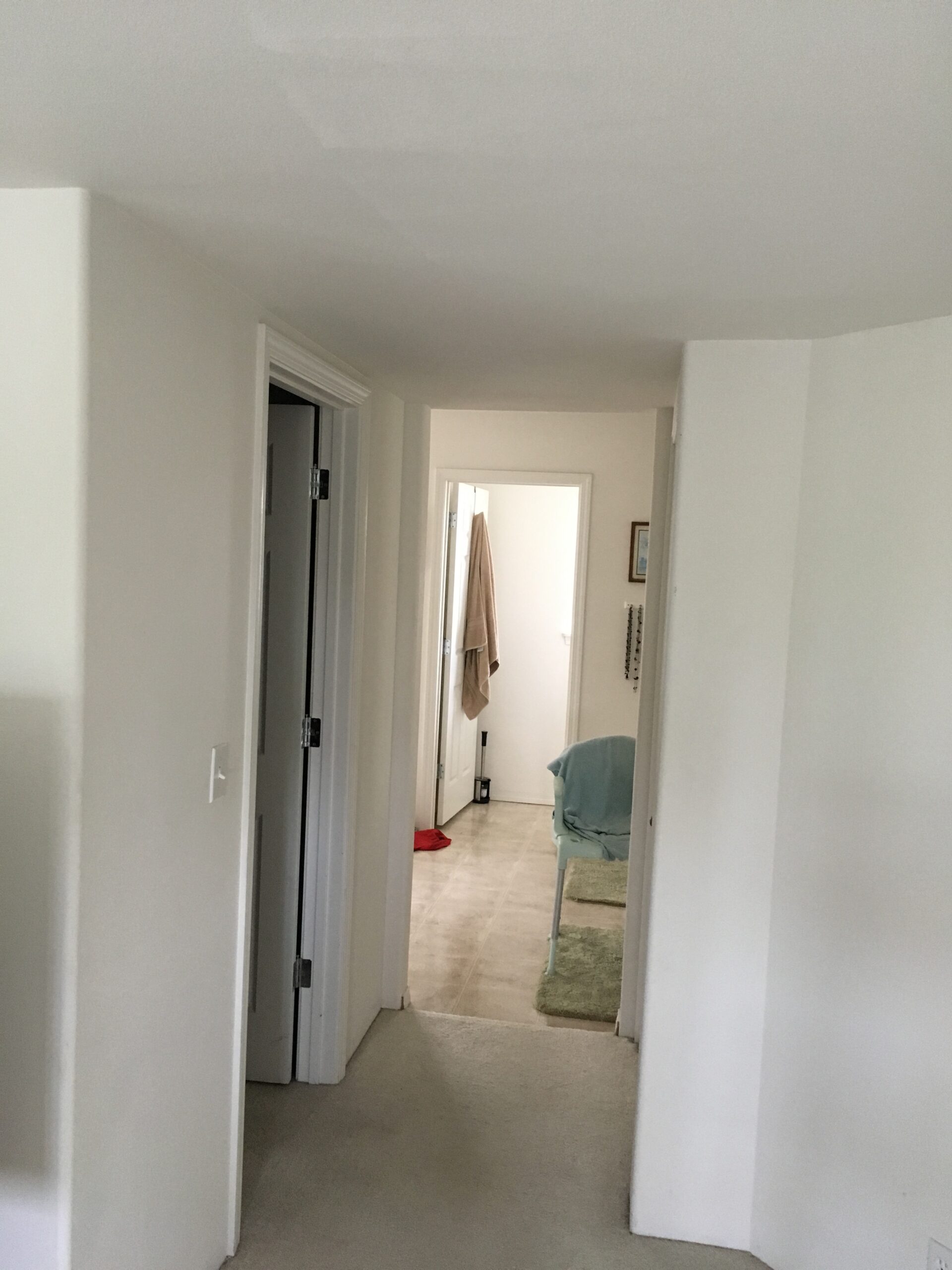 A ceiling track through the hallway: before installation