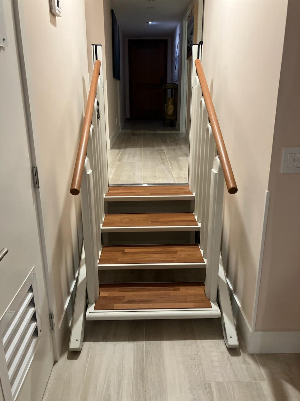 After FlexStep installation: the new stair-and-platform lift in the same hallway, shown in stair mode
